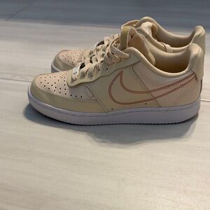 Nike Cream Sneakers with Pink Accent